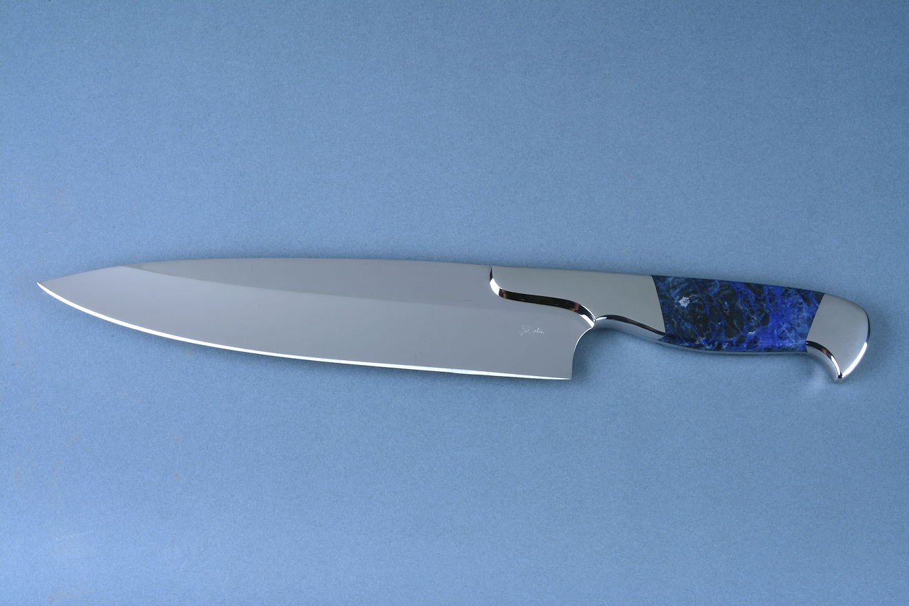 "Concordia" Chef's Knife, obverse side view in 440C high chromium martensitic stainless steel blade, T3 cryogenic heat treatment, 304 austenitic stainless steel bolsters, Sodalite gemstone handle "Concordia" Chef's Knife, obverse side view in 440C high chromium martensitic stainless steel blade, T3 cryogenic heat treatment, 304 austenitic stainless steel bolsters, Sodalite gemstone handle