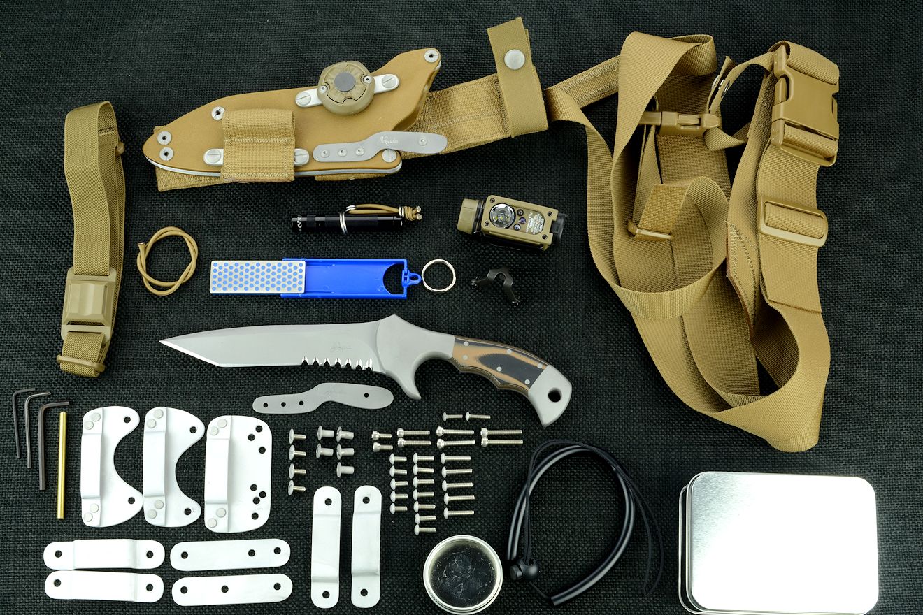 "Uvhash" tactical combat knife, obverse side view with accessories: tension-locking sheath, Ultimate Belt Loop Extender, sharpener, Lamp independent mount assembly with Maglite solitaire, Streamlight Sidewinder Compact II flashlight, lanyards, hardware, variable mounting straps and clamps, sternum harness, hardware "Uvhash" tactical combat knife, obverse side view with accessories: tension-locking sheath, Ultimate Belt Loop Extender, sharpener, Lamp independent mount assembly with Maglite solitaire, Streamlight Sidewinder Compact II flashlight, lanyards, hardware, variable mounting straps and clamps, sternum harness, hardware