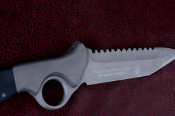 "Ari B'Lilah" reverse side blade view. Engraving is crisp and clean in 3" hollow grind with reinforced armor piercing tip, with hammerhead serrations at top blade edge