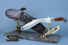 "Pallene" custom handmade knife sculpture, front right view. Silicon bronze cast by lost wax process in scuptural stand for khukri knife in hypereutectoid hand-engraved stainless steel