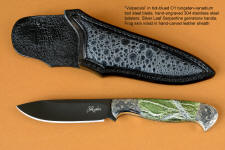 "Vulpecula" obverse side view in hot-blued O1 high carbon tungsten vanadium tool steel alloy, hand-engraved 304 stainless steel bolsters, Silver Leaf Serpentine gemstone handle, Frog skin inlaid in hand-carved leather sheath